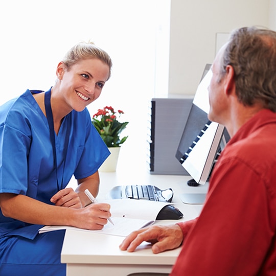Doctor talking to patient